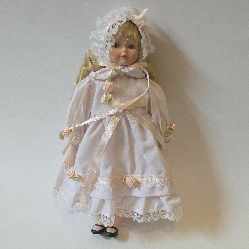 Elegant Porcelain Doll with Lace Dress